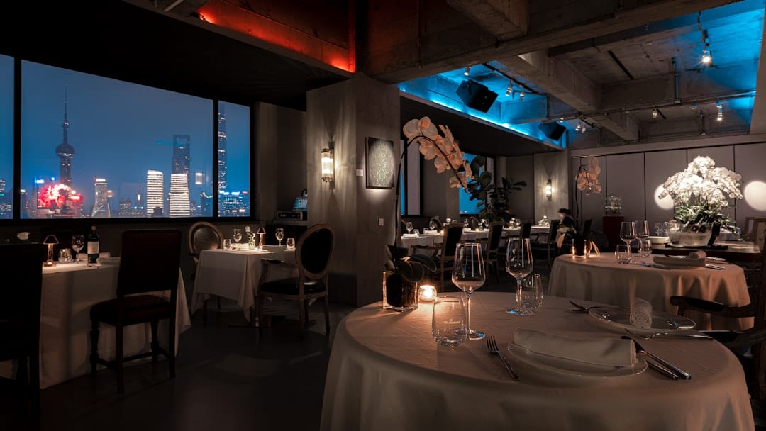 Premium editorial restaurant interior with warm ambient lighting