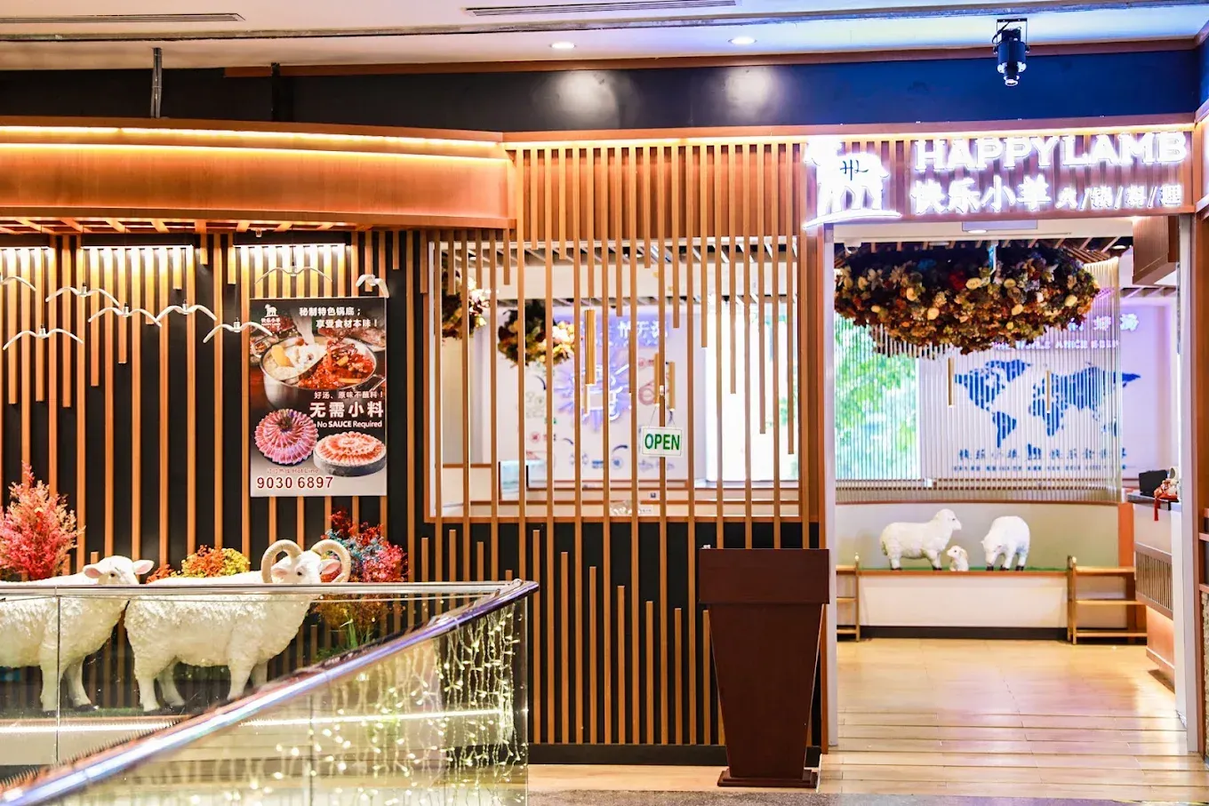 Happy Lamb Hotpot Singapore dining interior with traditional Mongolian hotpot setup